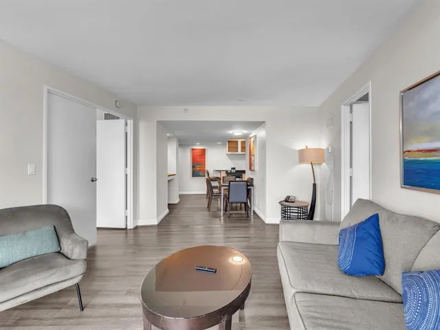 a living room with furniture and a table