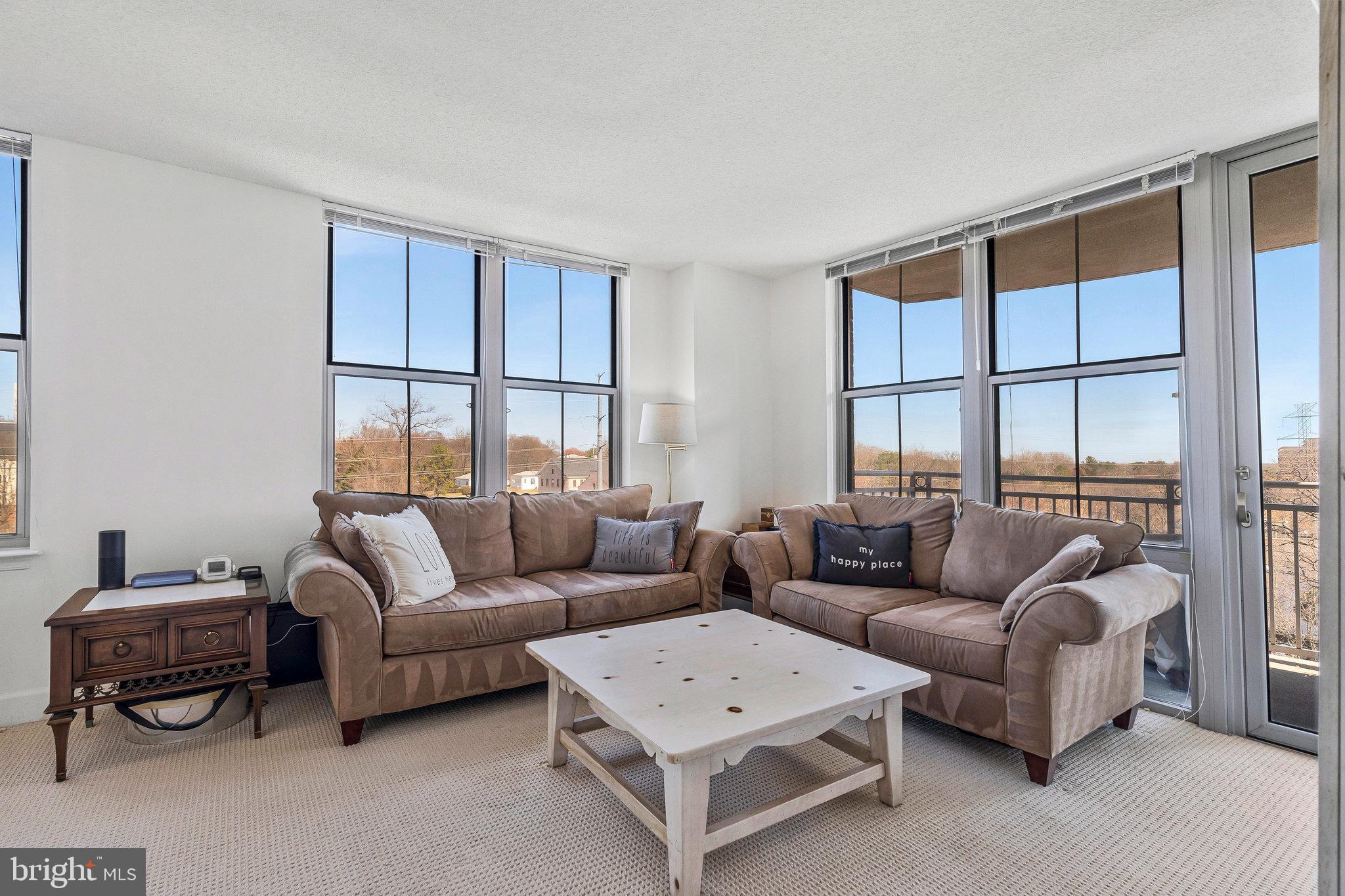 11800 Sunset Hills Road, Unit 522 Reston, VA 20190 - Photo 3 of 37 Living Room w/ floor to ceiling windows