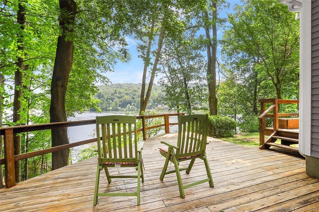 24 Craigmoor Road North Ridgefield, CT 06877 - Photo 1 of 1 a view of a balcony with wooden floor and outdoor seating