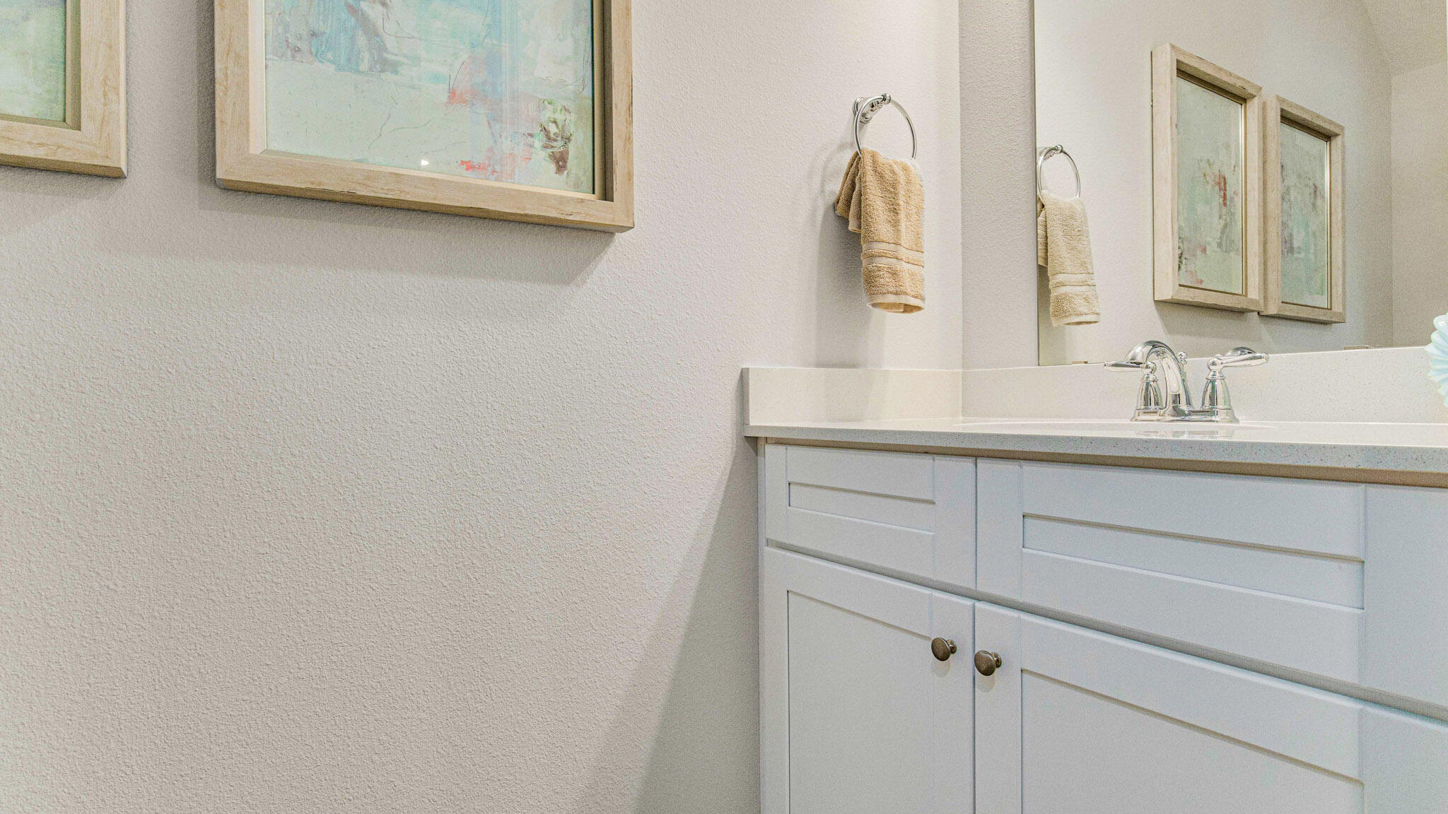 8509 Midtown Court Navarre, FL 32566 - Photo 25 of 27 a bathroom with a sink vanity and mirror