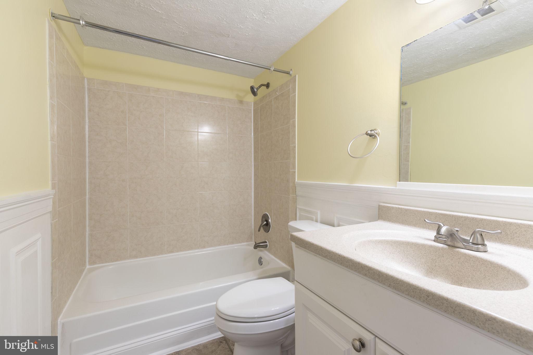 483 Moores Mill Road, Unit C Bel Air, MD 21014 - Photo 16 of 19 a bathroom with a granite countertop sink toilet and shower
