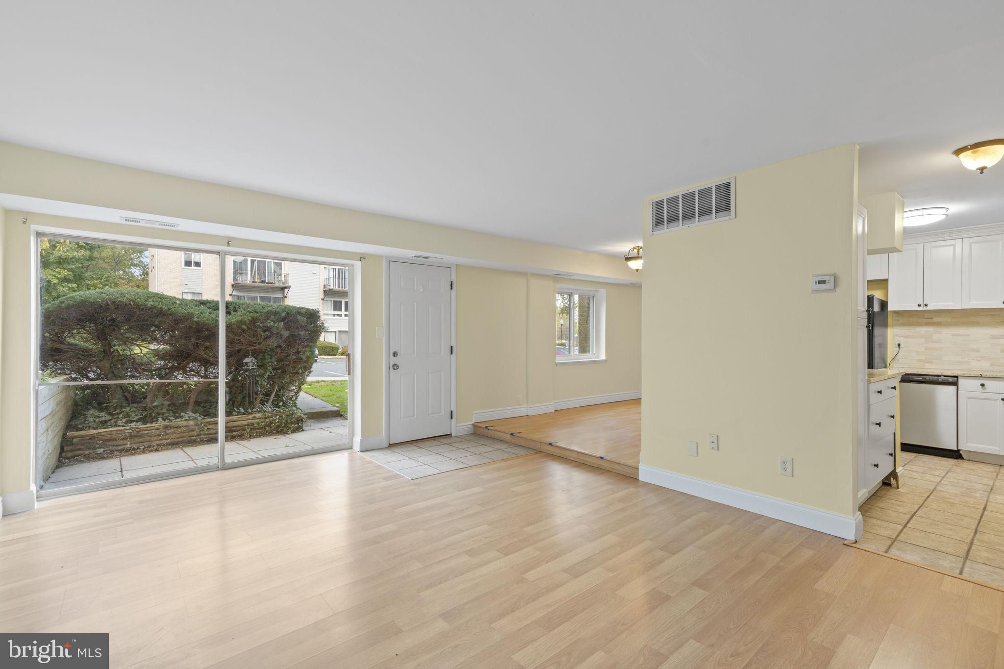 483 Moores Mill Road, Unit C Bel Air, MD 21014 - Photo 3 of 19 an empty room with wooden floor and windows