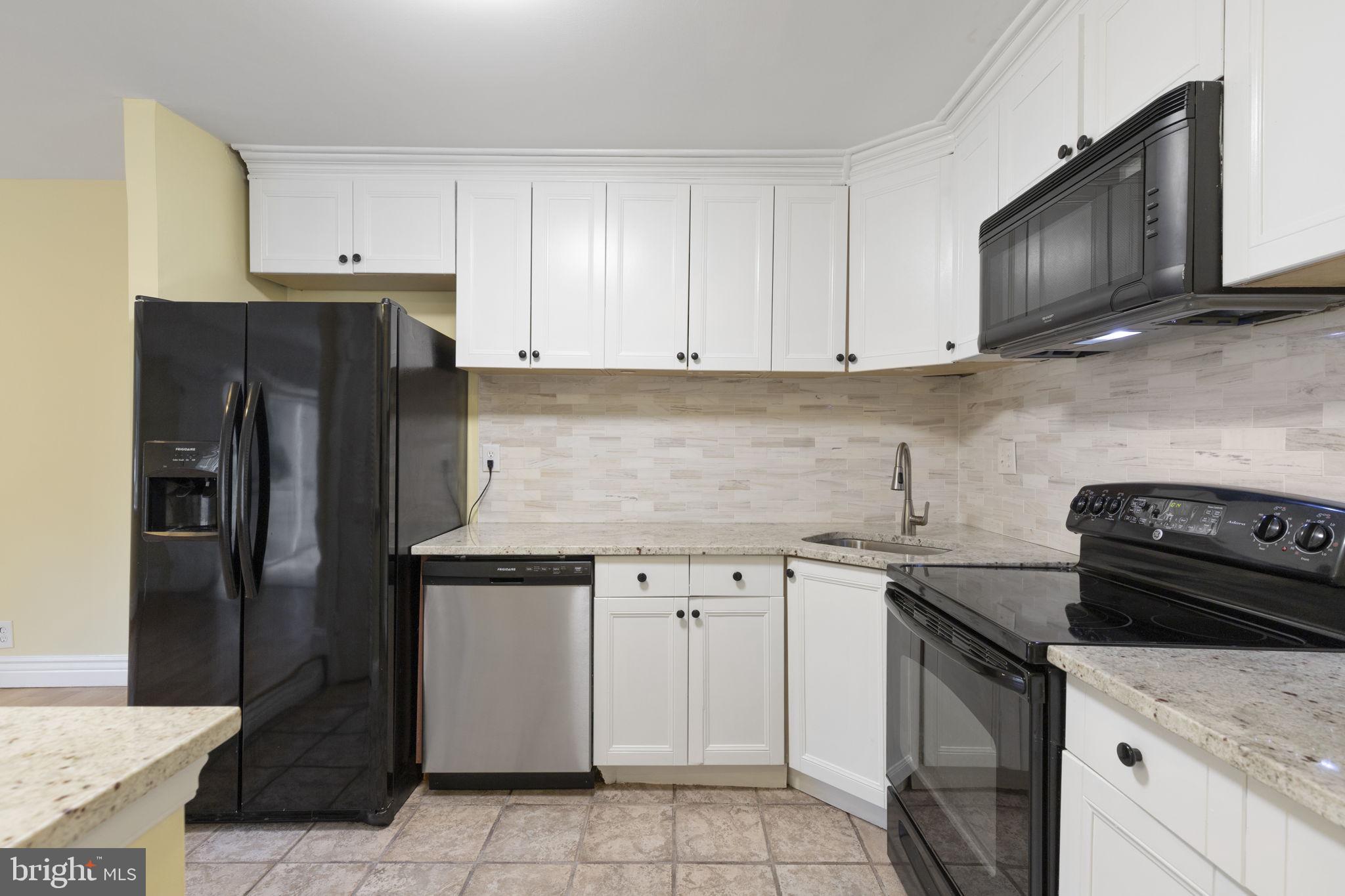 483 Moores Mill Road, Unit C Bel Air, MD 21014 - Photo 7 of 19 a kitchen with a sink stove and refrigerator