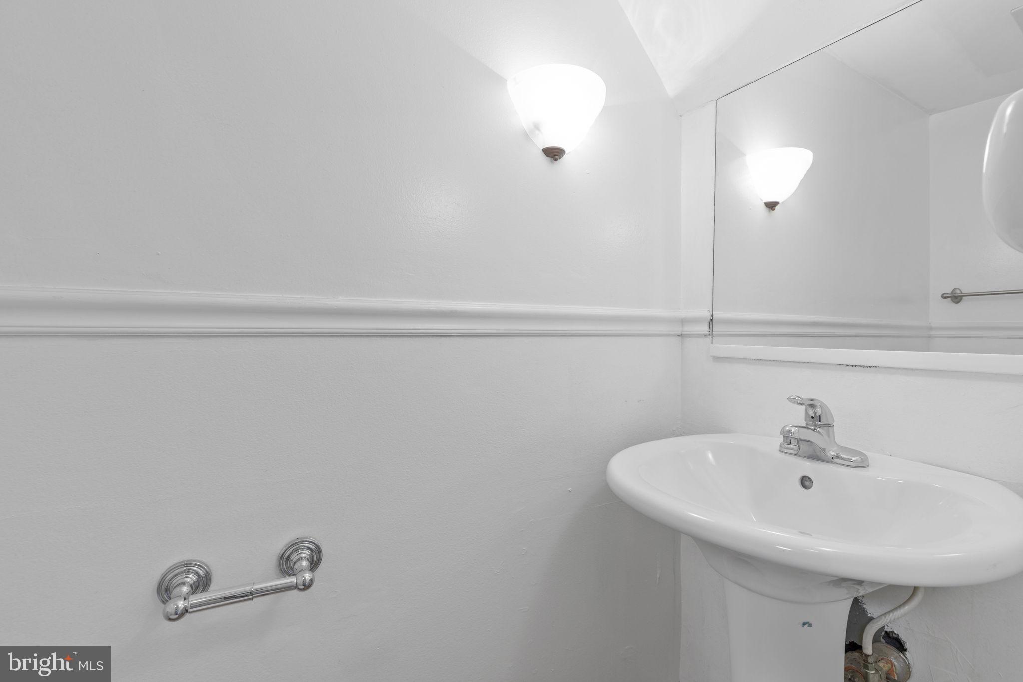 483 Moores Mill Road, Unit C Bel Air, MD 21014 - Photo 10 of 19 a bathroom with a sink and mirror