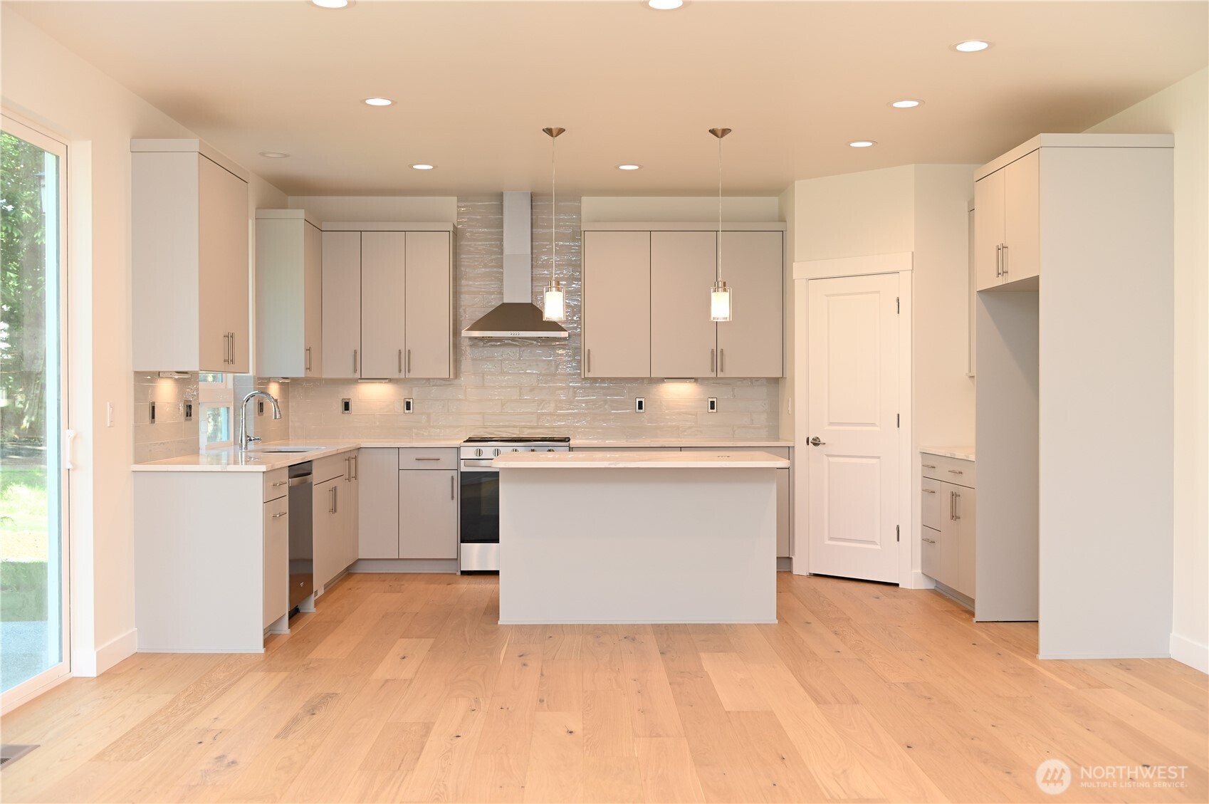 1323 Roland Street Bellingham, WA 98229 - Photo 8 of 16 a kitchen with white cabinets and white appliances
