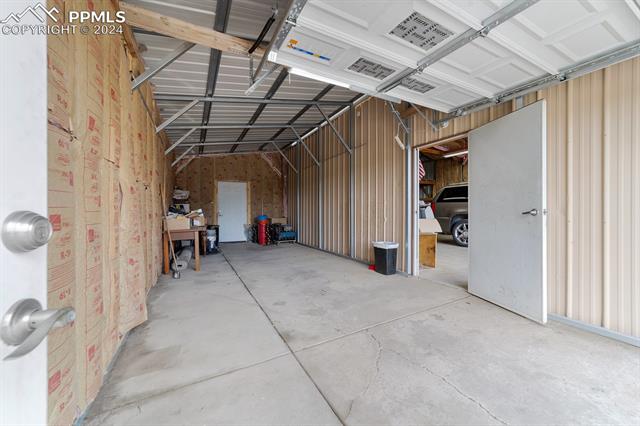 3240 Spaatz Road Monument, CO 80132 - Photo 40 of 45 View of South workshop/ detached garage bay, this bay is 28 ft deep. Has front and rear man doors and door to main shop.