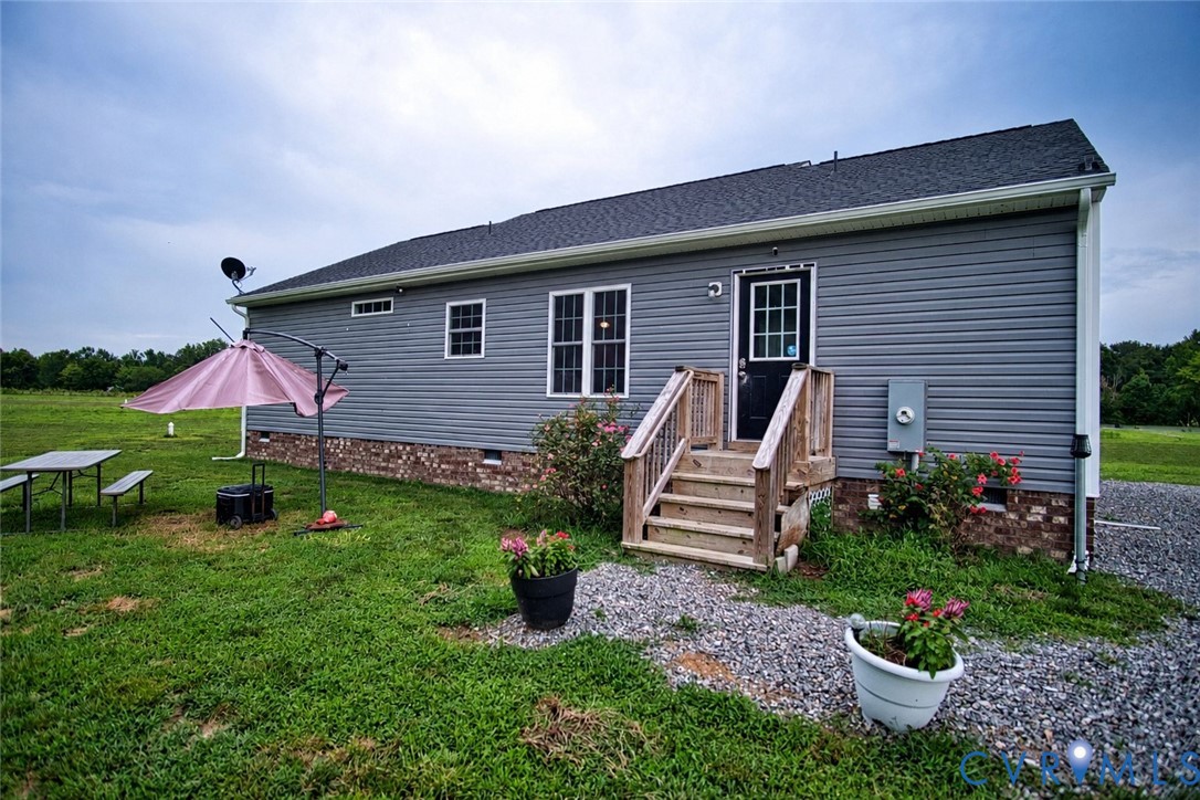 2255 Mahixon Road Manquin, VA 23106 - Photo 10 of 10 Exterior featuring grey horizontal siding, a dark