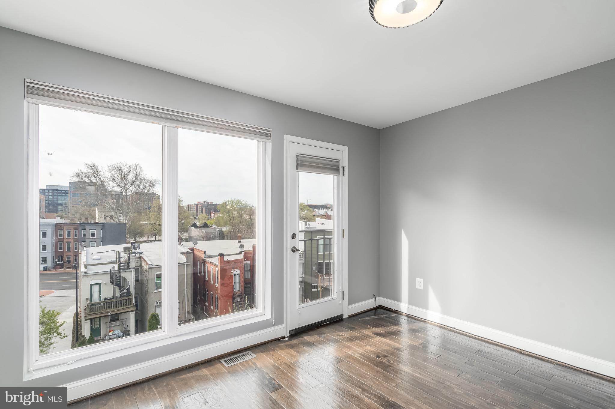 29 Q Street Northeast, Unit 2 Washington, DC 20002 - Photo 10 of 28 Bedroom 3 faces south and has a juliet balcony.