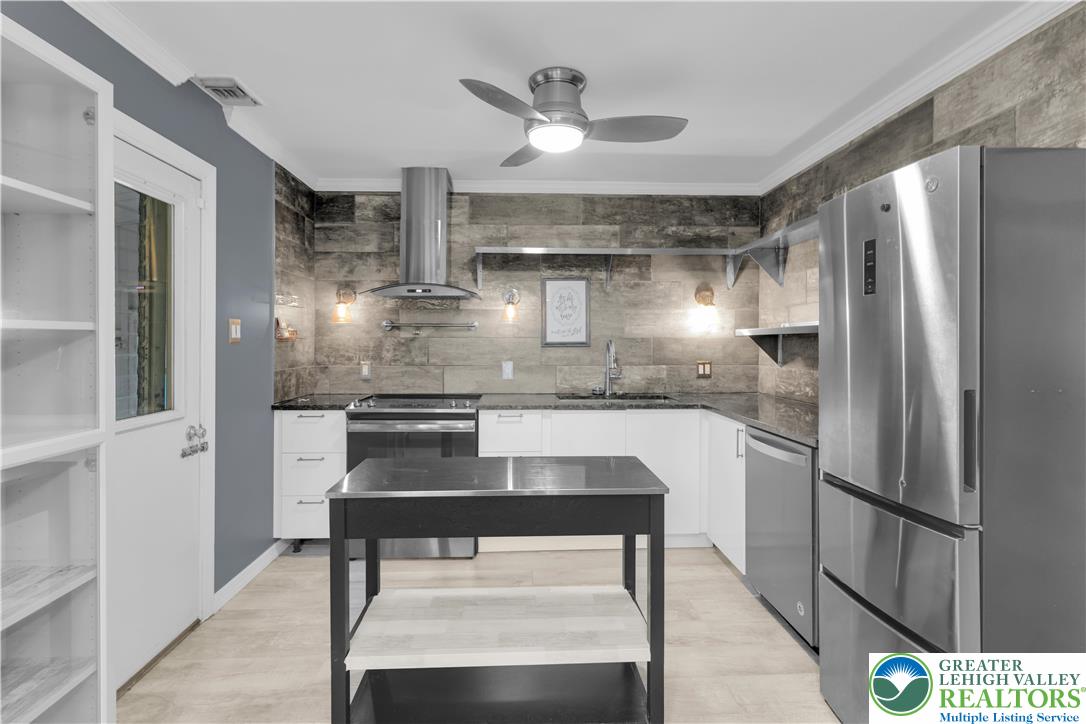 1942 Greenleaf Street Bethlehem, PA 18017 - Photo 12 of 41 a kitchen with stainless steel appliances a refrigerator and a stove top oven