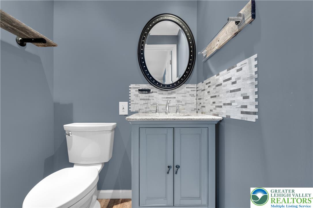 1942 Greenleaf Street Bethlehem, PA 18017 - Photo 16 of 41 a bathroom with a toilet sink and mirror