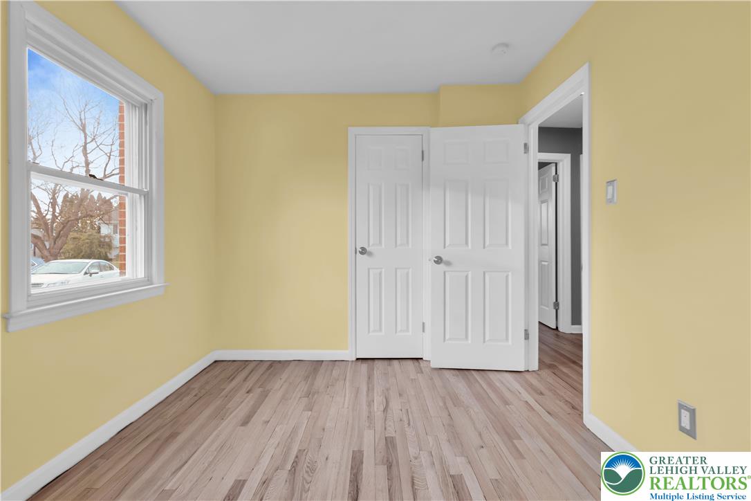 1942 Greenleaf Street Bethlehem, PA 18017 - Photo 18 of 41 an empty room with wooden floor and windows