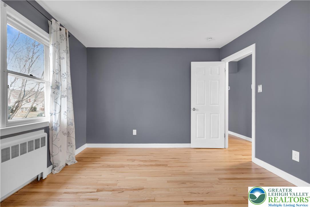 1942 Greenleaf Street Bethlehem, PA 18017 - Photo 19 of 41 a view of an empty room with wooden floor and a window