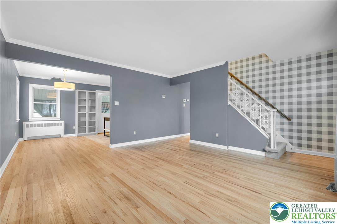 1942 Greenleaf Street Bethlehem, PA 18017 - Photo 6 of 41 a view of an empty room with wooden floor and staircase
