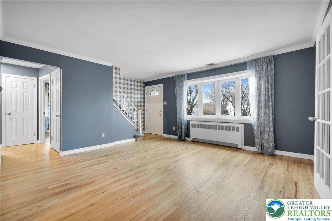 1942 Greenleaf Street Bethlehem, PA 18017 - Photo 8 of 41 a view of an empty room with a window and wooden floor