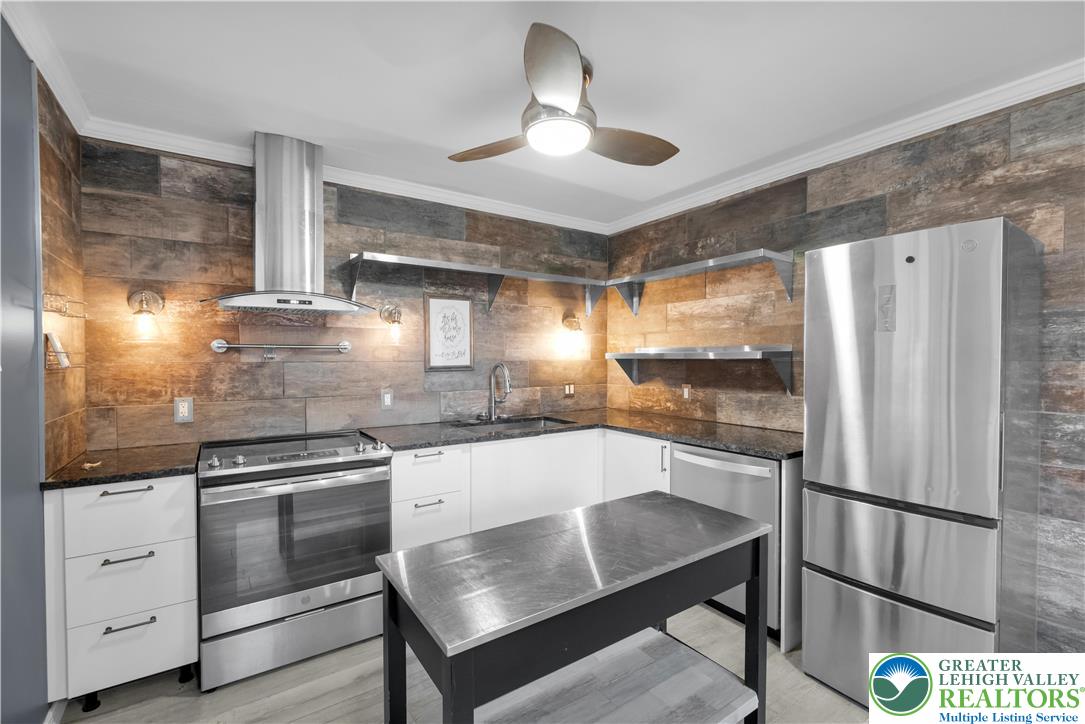 1942 Greenleaf Street Bethlehem, PA 18017 - Photo 10 of 41 a kitchen with granite countertop white cabinets and stainless steel appliances