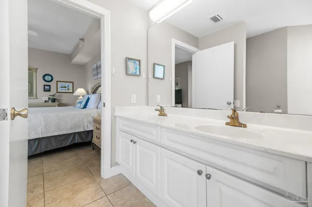 a spacious bedroom with a bed and a couch