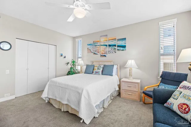 a bathroom with a sink a toilet and a large mirror
