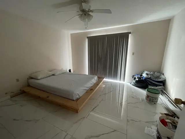 a bathroom with a shower and a sink