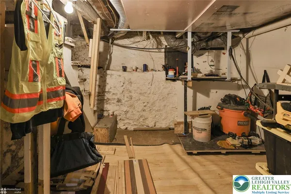 a bedroom with a bed and a table