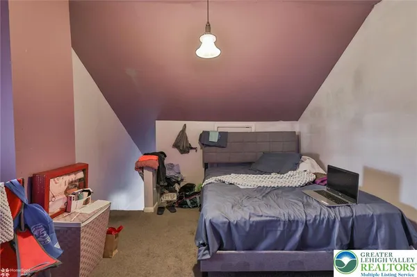 a room with table and flat screen tv