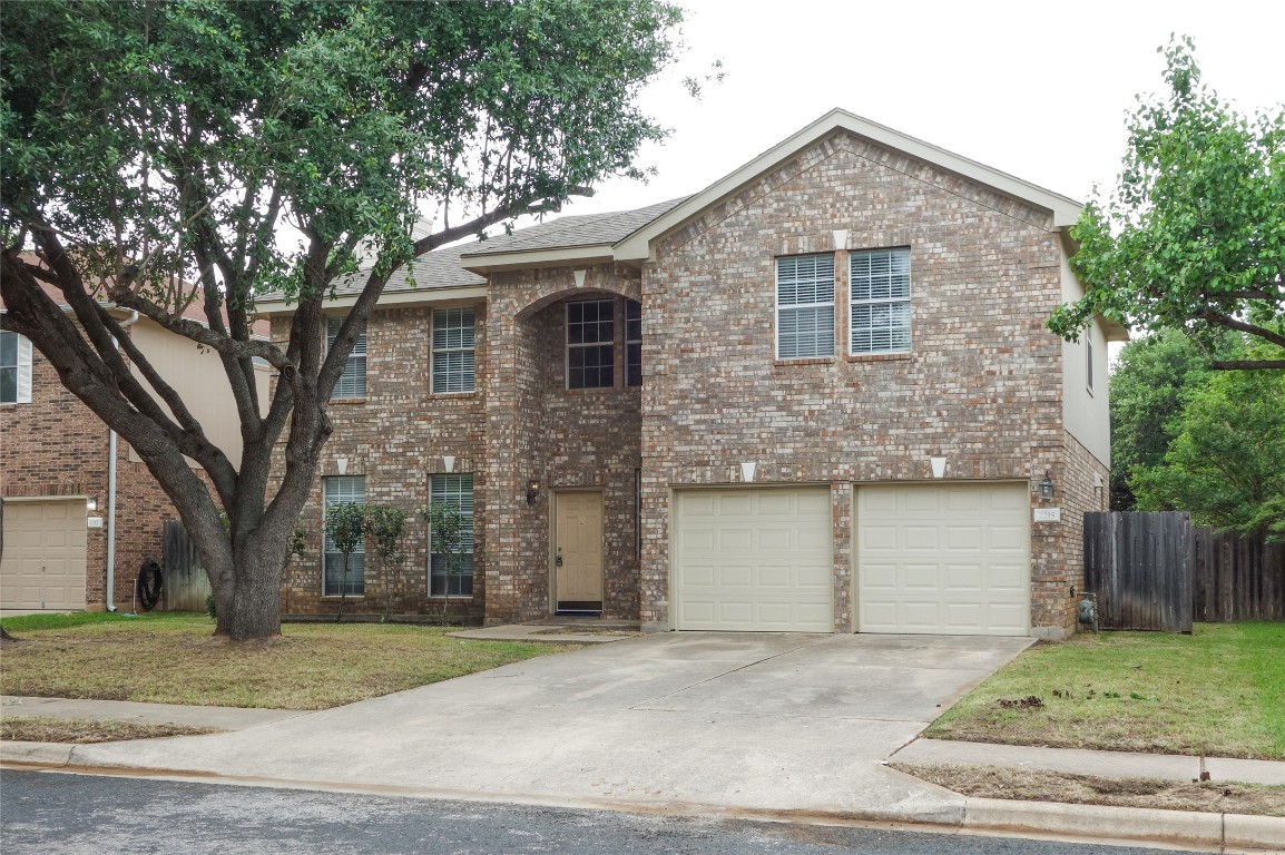 2215 Bent Bow Drive Cedar Park, TX 78613 - Photo 1 of 1 a front view of a house with a yard and garage