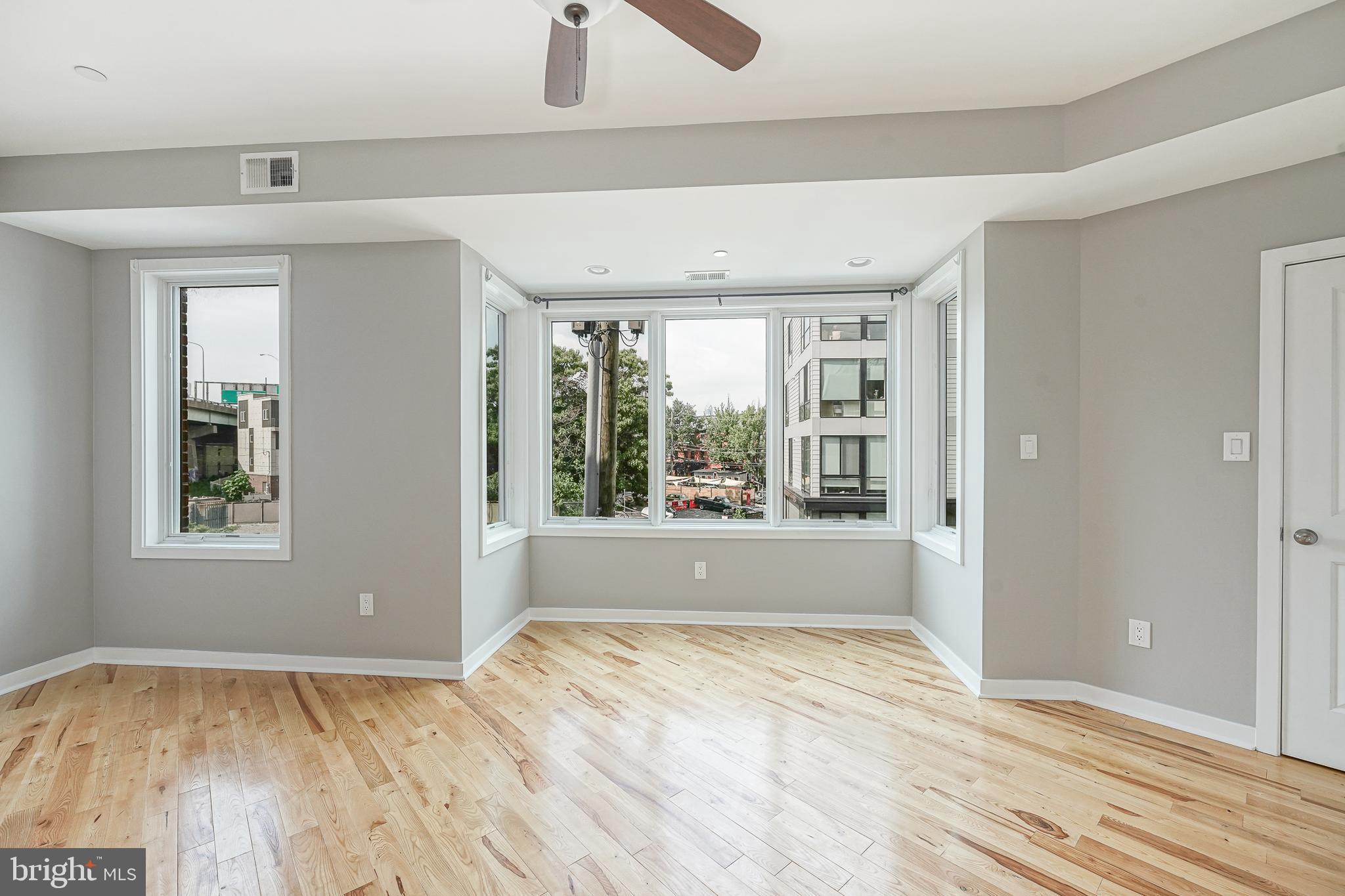 1011 Germantown Avenue, Unit B Philadelphia, PA 19123 - Photo 12 of 34 a view of empty room with wooden floor and fan