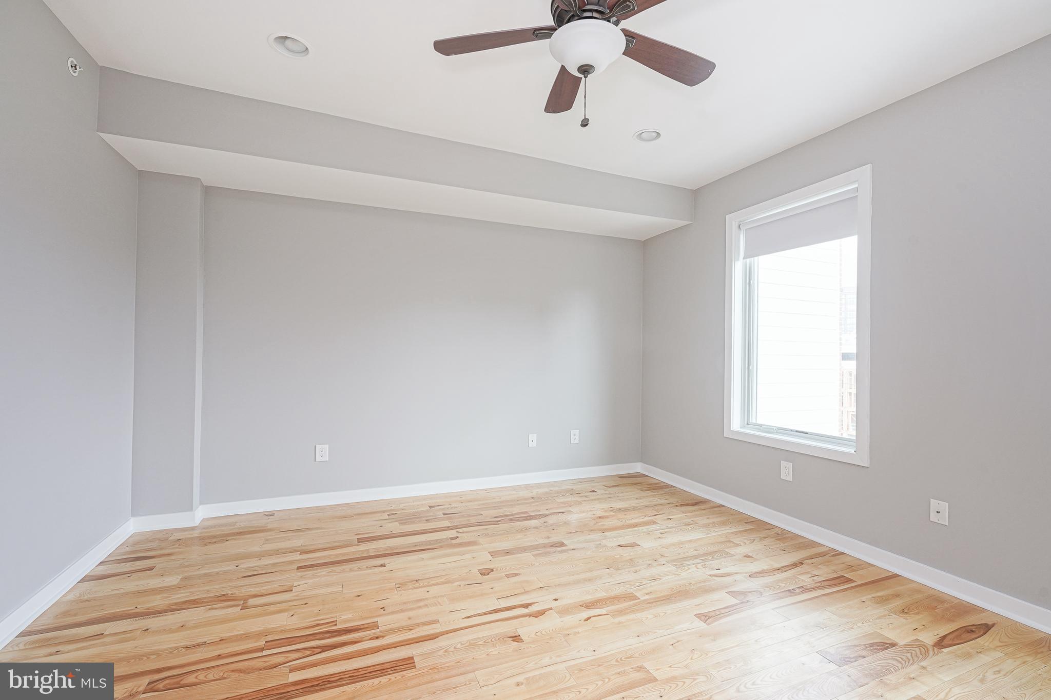 1011 Germantown Avenue, Unit B Philadelphia, PA 19123 - Photo 14 of 34 wooden floor in an empty room with a window
