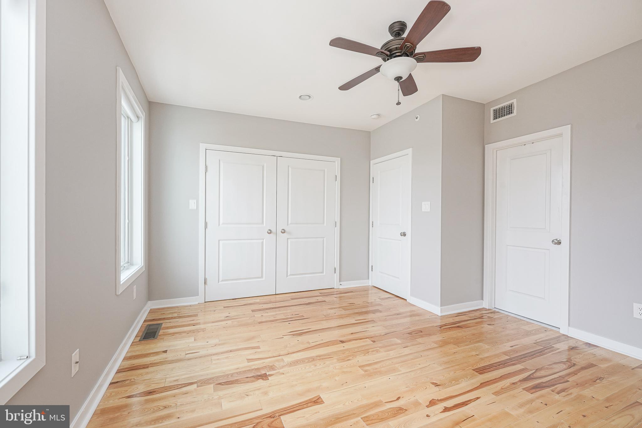 1011 Germantown Avenue, Unit B Philadelphia, PA 19123 - Photo 15 of 34 a big room with wooden floor and a chandelier fan