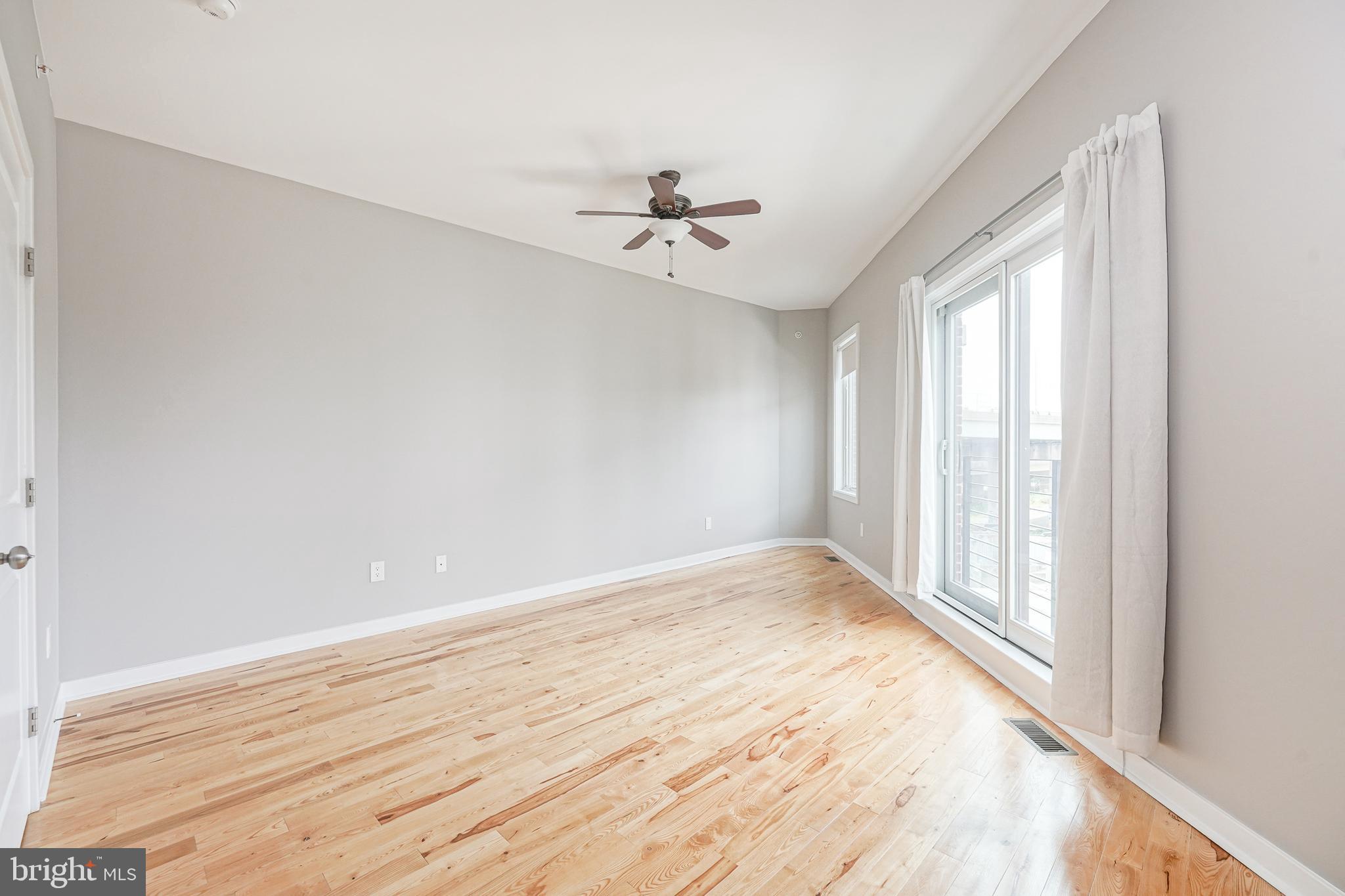 1011 Germantown Avenue, Unit B Philadelphia, PA 19123 - Photo 23 of 34 wooden floor in an empty room with a window