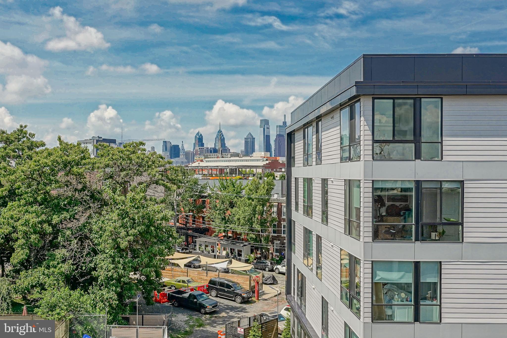 1011 Germantown Avenue, Unit B Philadelphia, PA 19123 - Photo 27 of 34 a front view of a house with plants and trees