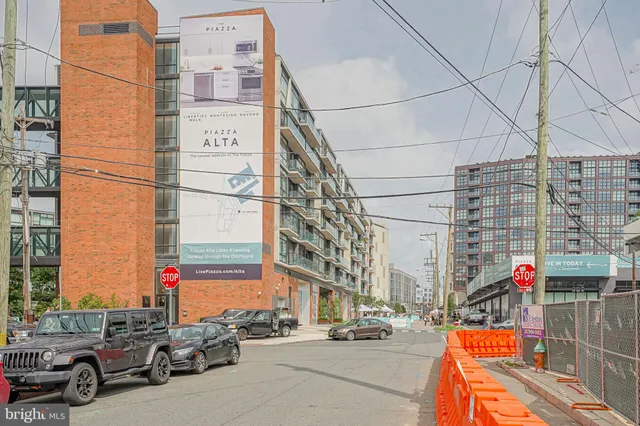 a city street lined with tall buildings and cars