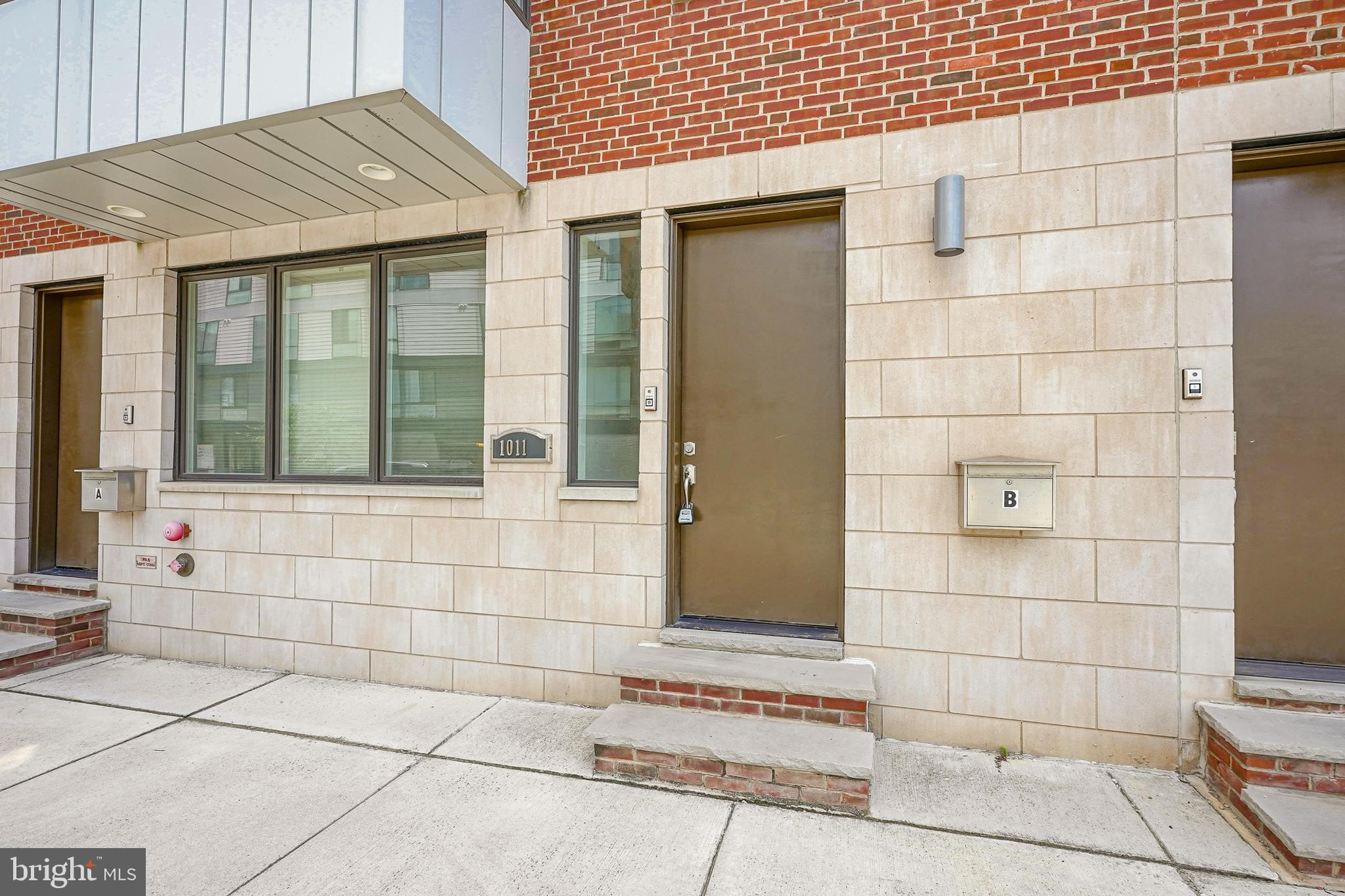 1011 Germantown Avenue, Unit B Philadelphia, PA 19123 - Photo 33 of 34 a view of a brick house with a window