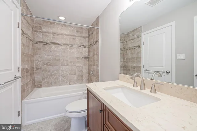 a bathroom with a sink a toilet and a bathtub