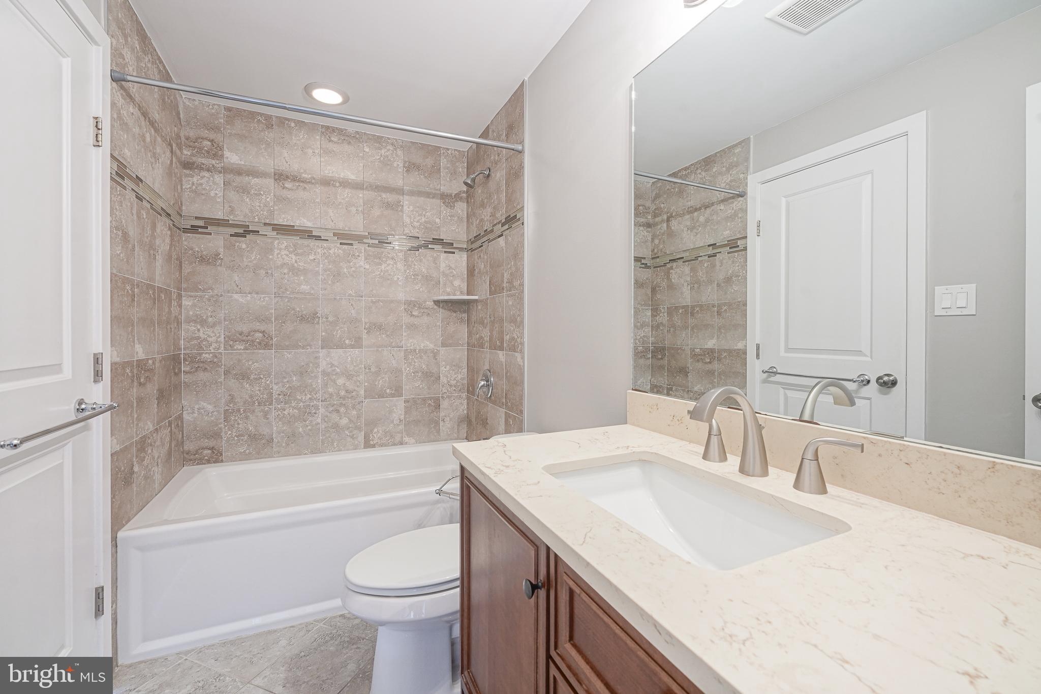 1011 Germantown Avenue, Unit B Philadelphia, PA 19123 - Photo 9 of 34 a bathroom with a sink a toilet and a bathtub