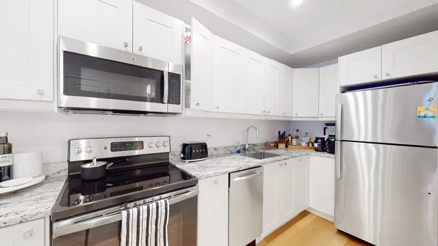 a kitchen with a stove microwave and refrigerator