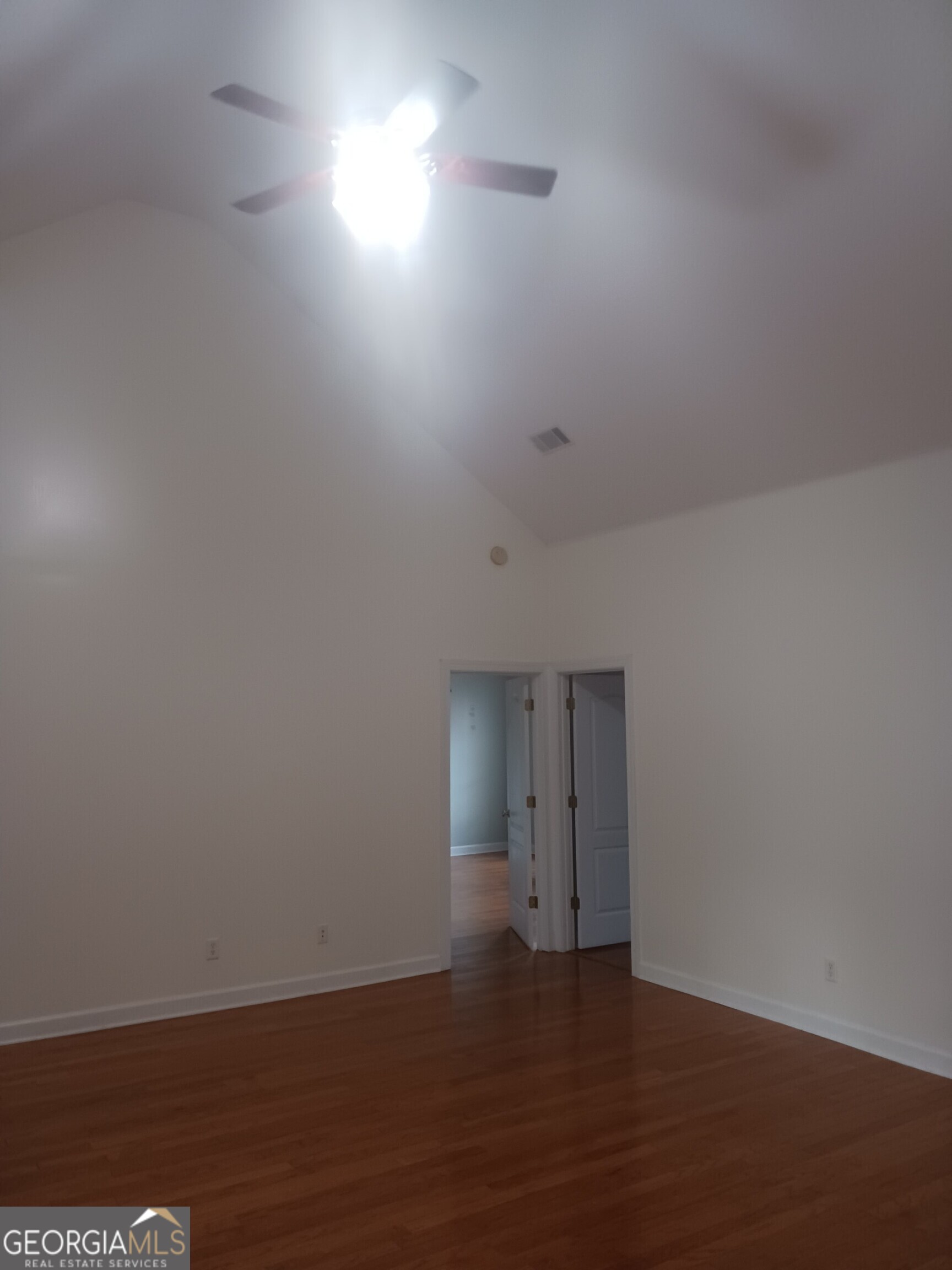 605 Patrick Way Statesboro, GA 30458 - Photo 15 of 58 a view of an empty room and wooden floor and a window