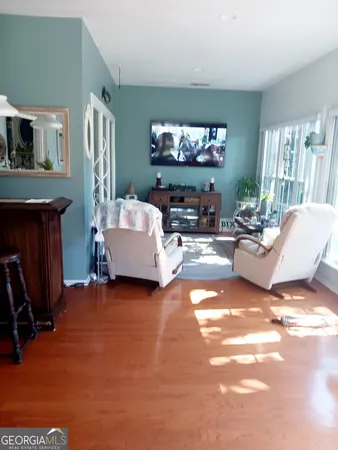 a large kitchen with stainless steel appliances a large counter top