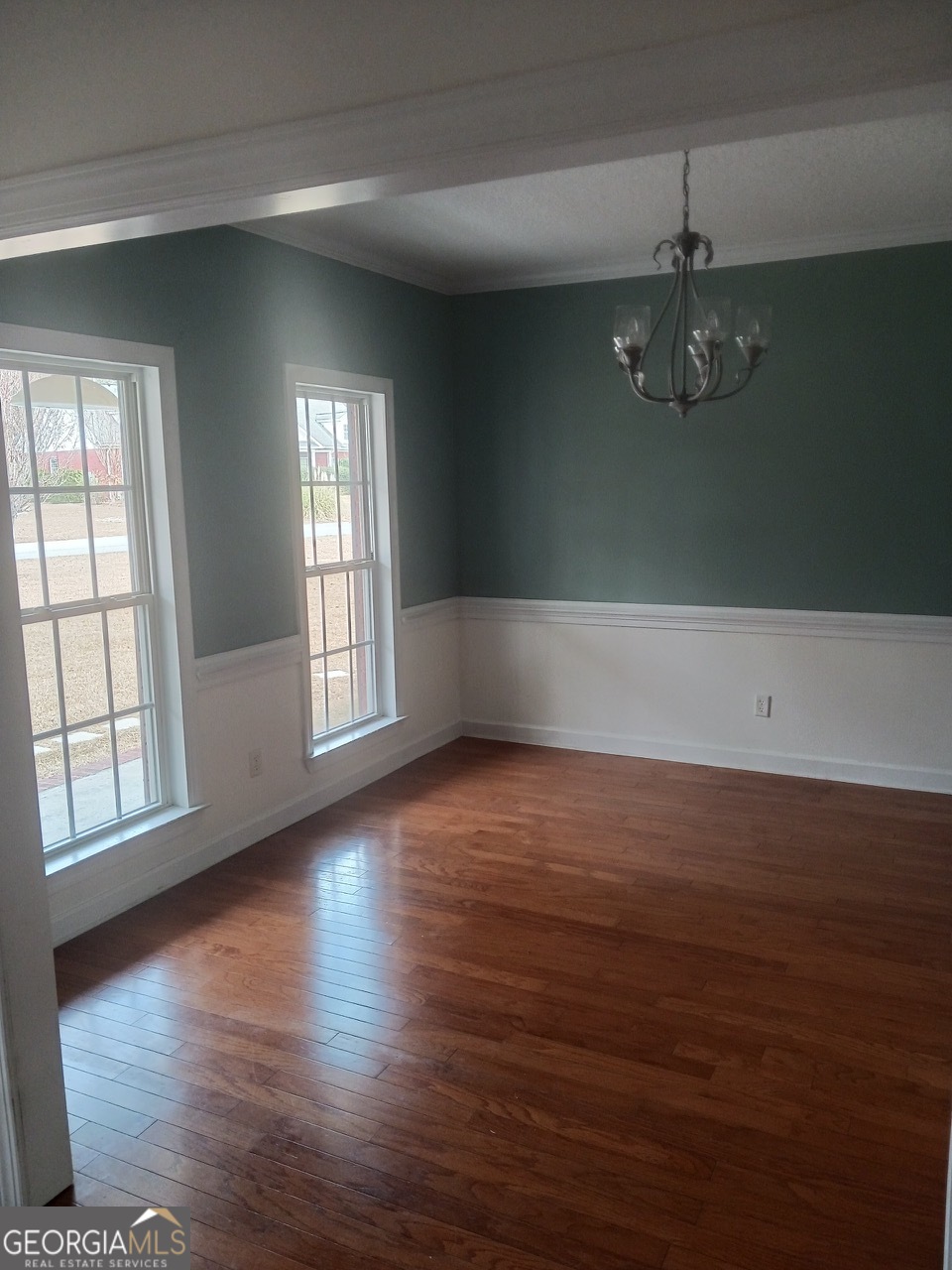 605 Patrick Way Statesboro, GA 30458 - Photo 19 of 58 an empty room with wooden floor and windows