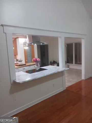 a kitchen with stainless steel appliances granite countertop a stove and a refrigerator