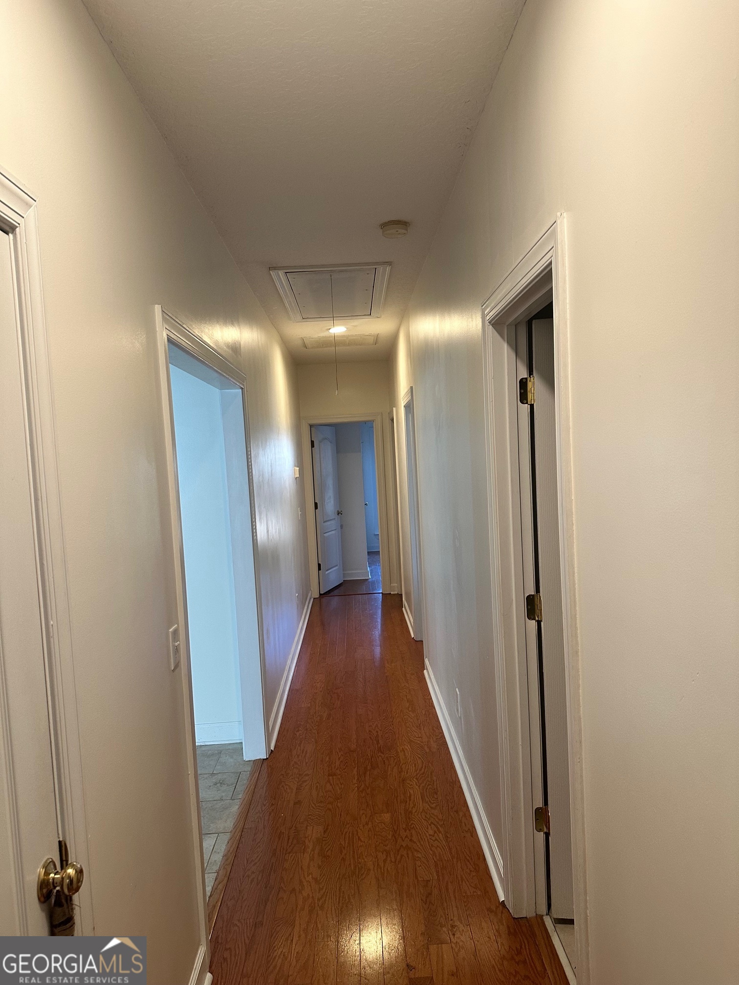 605 Patrick Way Statesboro, GA 30458 - Photo 38 of 58 a view of a hallway with wooden floor