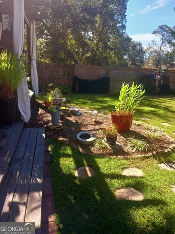 a view of a chairs and table in the patio