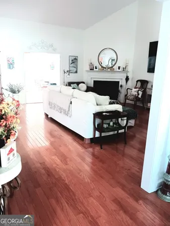 a view of a room with window and a ceiling fan