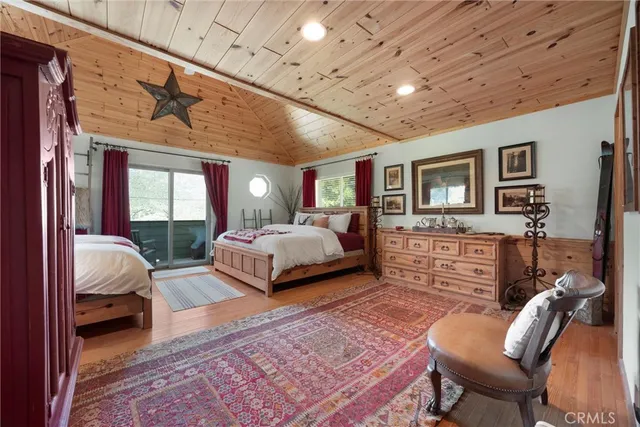 a bedroom with a bed window and couch