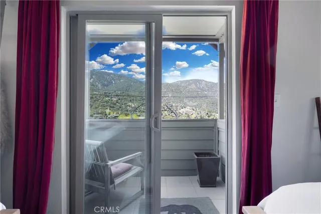 a bedroom with furniture window and wooden floor