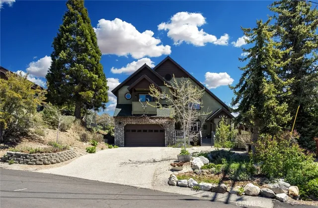 a view of a patio with couches table and chairs and potted plants