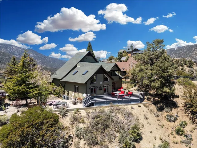 a view of a backyard of the house