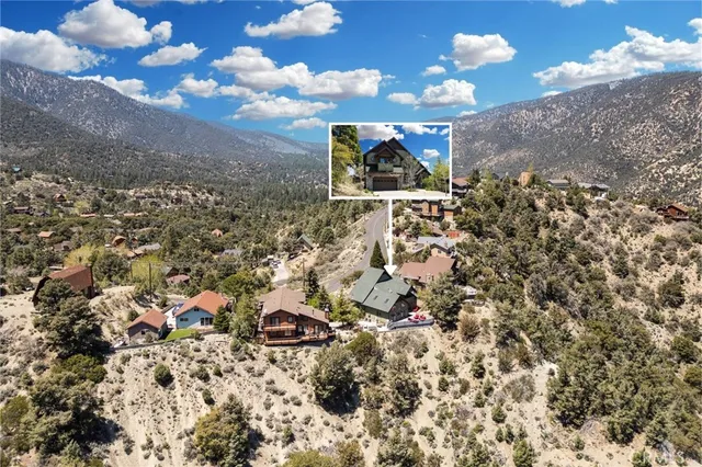 an aerial view of a houses with outdoor space