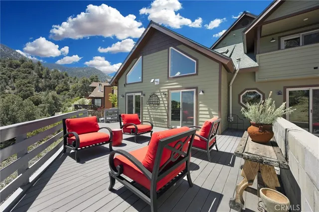 a outdoor living space with furniture and a fireplace