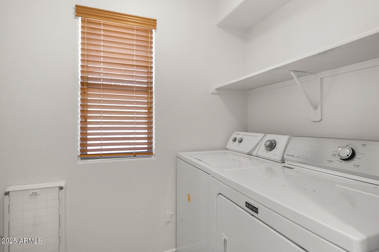 3297 East Warbler Road Gilbert, AZ 85297 - Photo 27 of 32 a utility room with dryer and washer