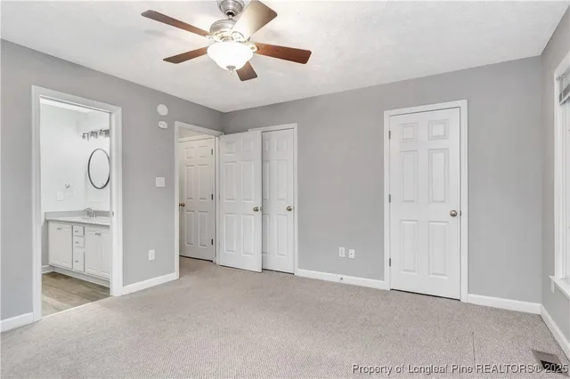 a view of a livingroom with a chandelier fan